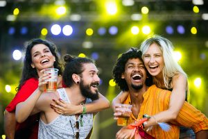 group-of-friends-having-fun-time-at-music-festival-ATZ7KVD (1)